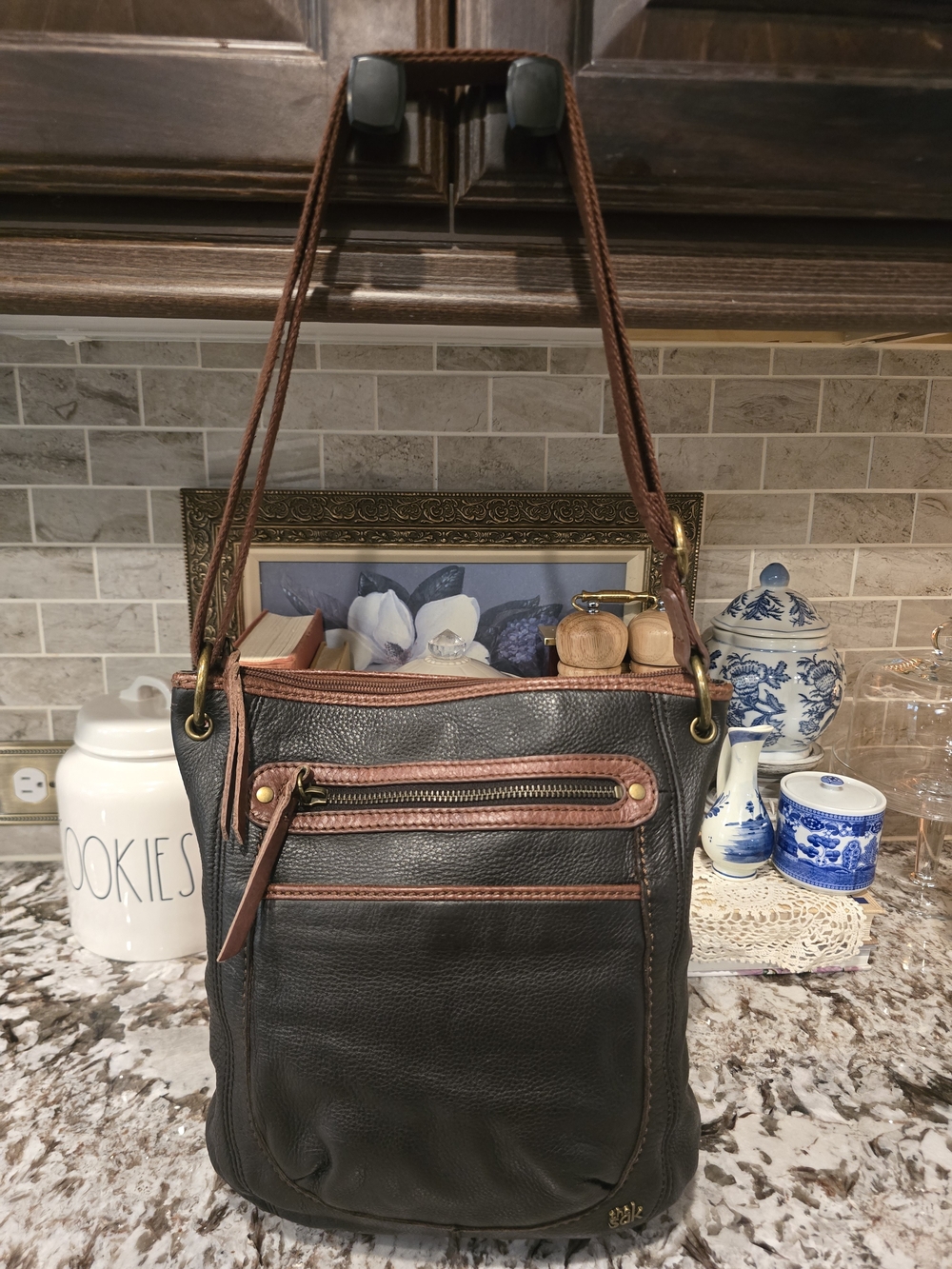 The Sak Black Leather Shoulder Bag with Brown Trim